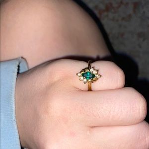 Elegant Gold banded dimond and emerald Ring